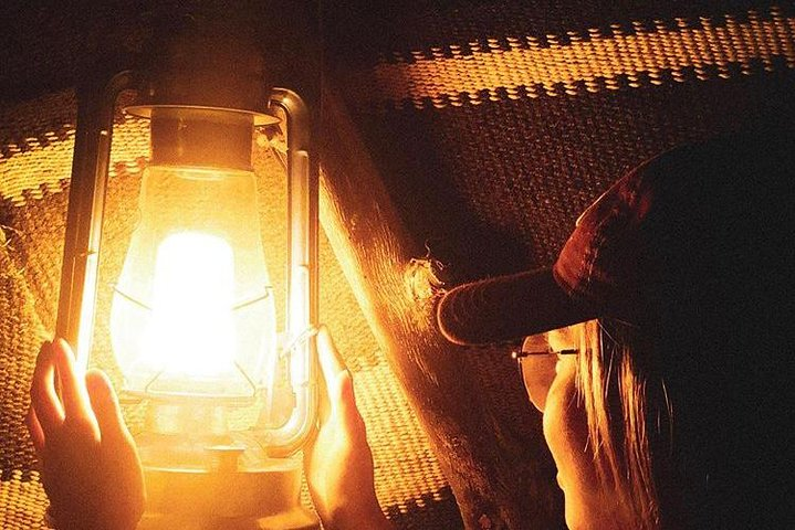 Experience the allure of Dubai's nighttime wonders as warm lantern light guides your exploration of iconic landmarks and hidden gems revealing the city's charm under a starry sky.